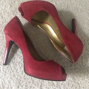 Red suede peep toe pumps